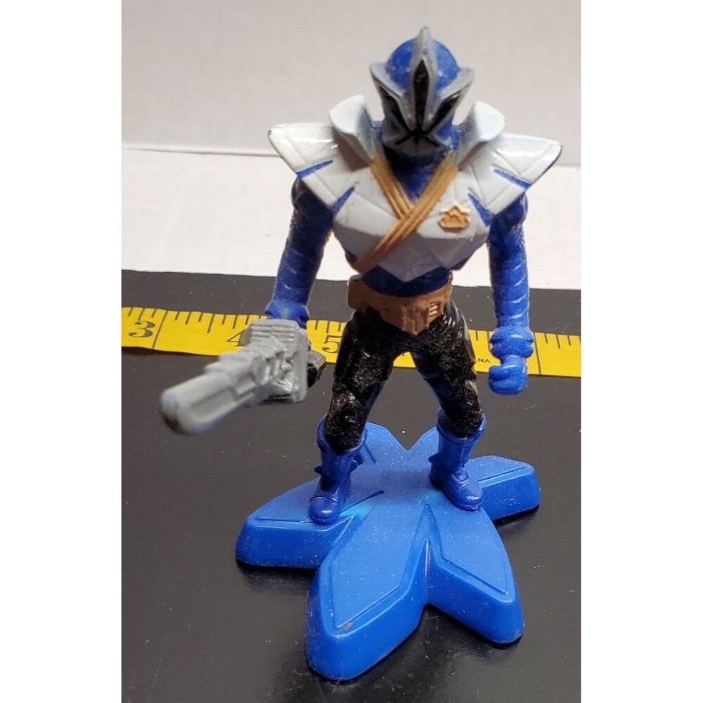 Blue‎ Action Figure On Star-Shaped Base With Sword
